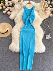 Bright blue sleeveless knit bodycon midi dress, back view with knotted open back on hanger