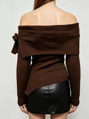 Back view of brown off shoulder ribbed knit top with wide neckline and asymmetric hem