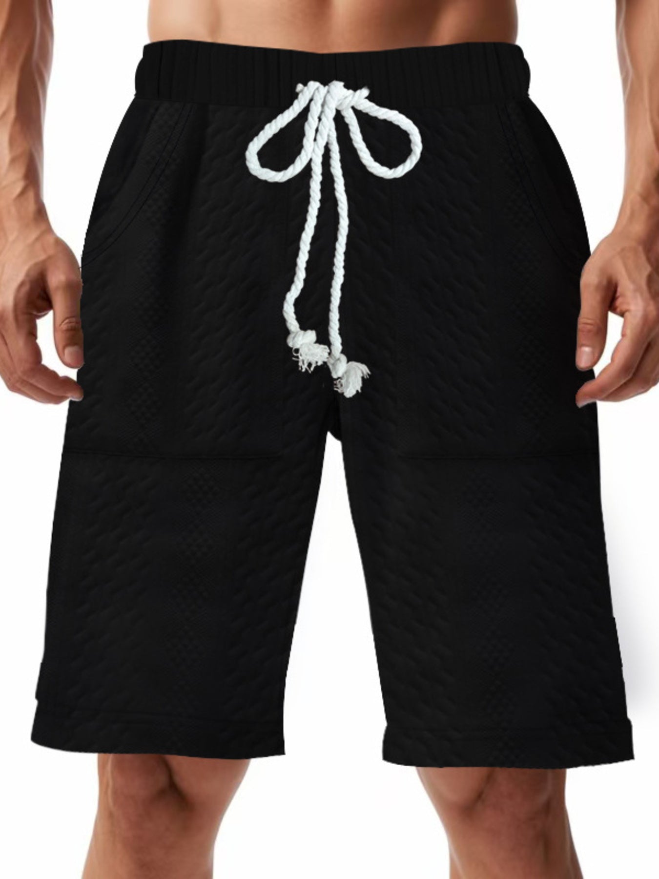 Men's black textured shorts with a drawstring waist and pockets.