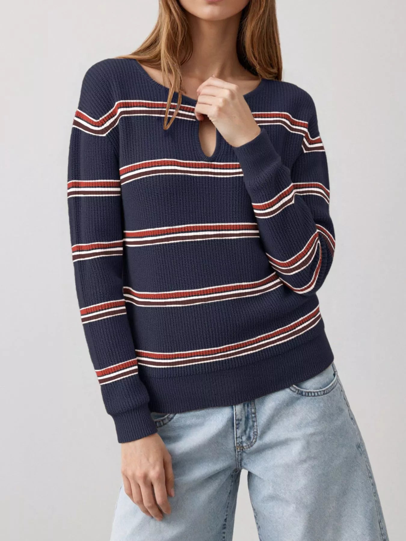 Front view of a dark blue striped ribbed knit top with a keyhole neckline