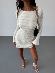 Model wearing pale apricot textured flare sleeve bodycon mini dress, full front view with heels