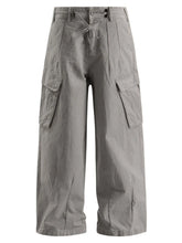 Men's light gray wide-leg cargo pants with a drawstring waist and pockets.