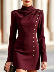 Model outdoors wearing burgundy mock neck mini dress with long sleeves and gold decorative buttons
