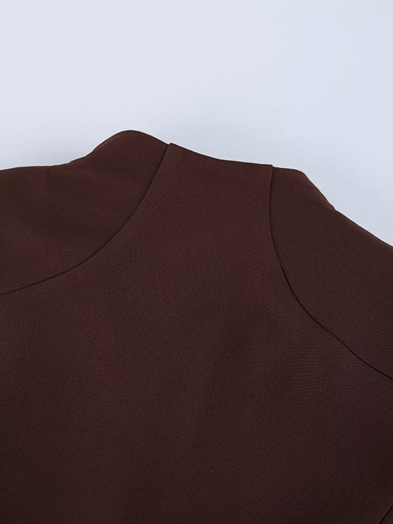 Brown button down mini dress detail showing back collar and shoulder seams flat