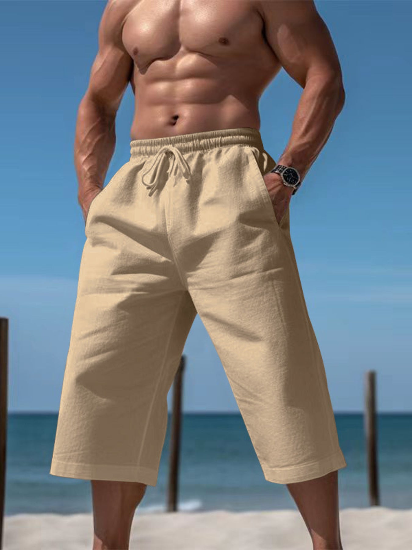Men's light khaki cropped casual pants with a drawstring waist and pockets.