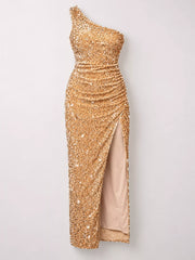 Gold sequin one shoulder evening dress shown flat front facing with a high slit