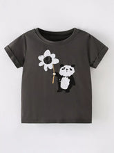 Front view of a dark gray children's short sleeve shirt with a panda holding a large white flower