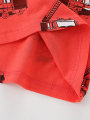 Close-up detail of the red hem stitching and fire truck print on children's T-shirt
