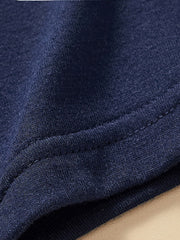 Close-up of the hem stitching and soft fabric on the children's dark navy t-shirt