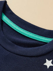 Close-up of the crew neckline with green inner trim on the children's dark navy t-shirt