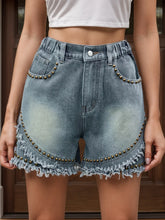 Women's Air Force Blue studded denim shorts with buttons, pockets, and raw hems.
