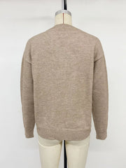 Back view of khaki dropped shoulder long sleeve sweater on mannequin with ribbed hem