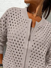 Close up of the light taupe crochet cardigan upper zip and openwork pattern