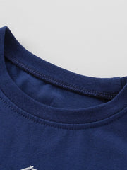 Close-up of ribbed crew neckline and stitching on navy children's tee