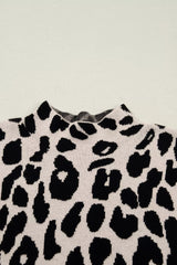 Close up detail of the high neckline on the black and cream leopard print knit sweater.