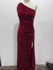 Burgundy sequin one shoulder evening dress shown front facing on a dress form with a high slit