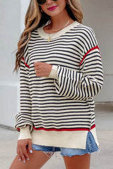 Closer on-model front view of the striped oversized sweater with red shoulder seam detail