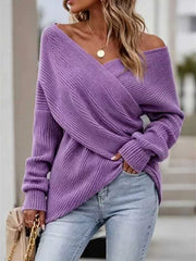 Front view of purple ribbed knit sweater with crisscross V neckline and long sleeves.