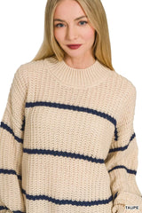 Close front view of cream striped oversize sweater showing mock neck and knit texture