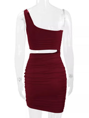 Back view of burgundy one shoulder cutout ruched bodycon mini dress on a clear mannequin