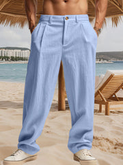 Men's light blue pleated pants with pockets and a relaxed fit.