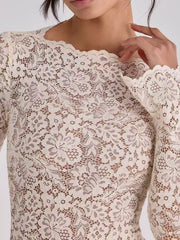 Close detail of ivory floral lace neckline and long sleeve on maxi dress