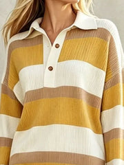 Closeup of yellow striped sweater dress bodice showing polo collar and button placket
