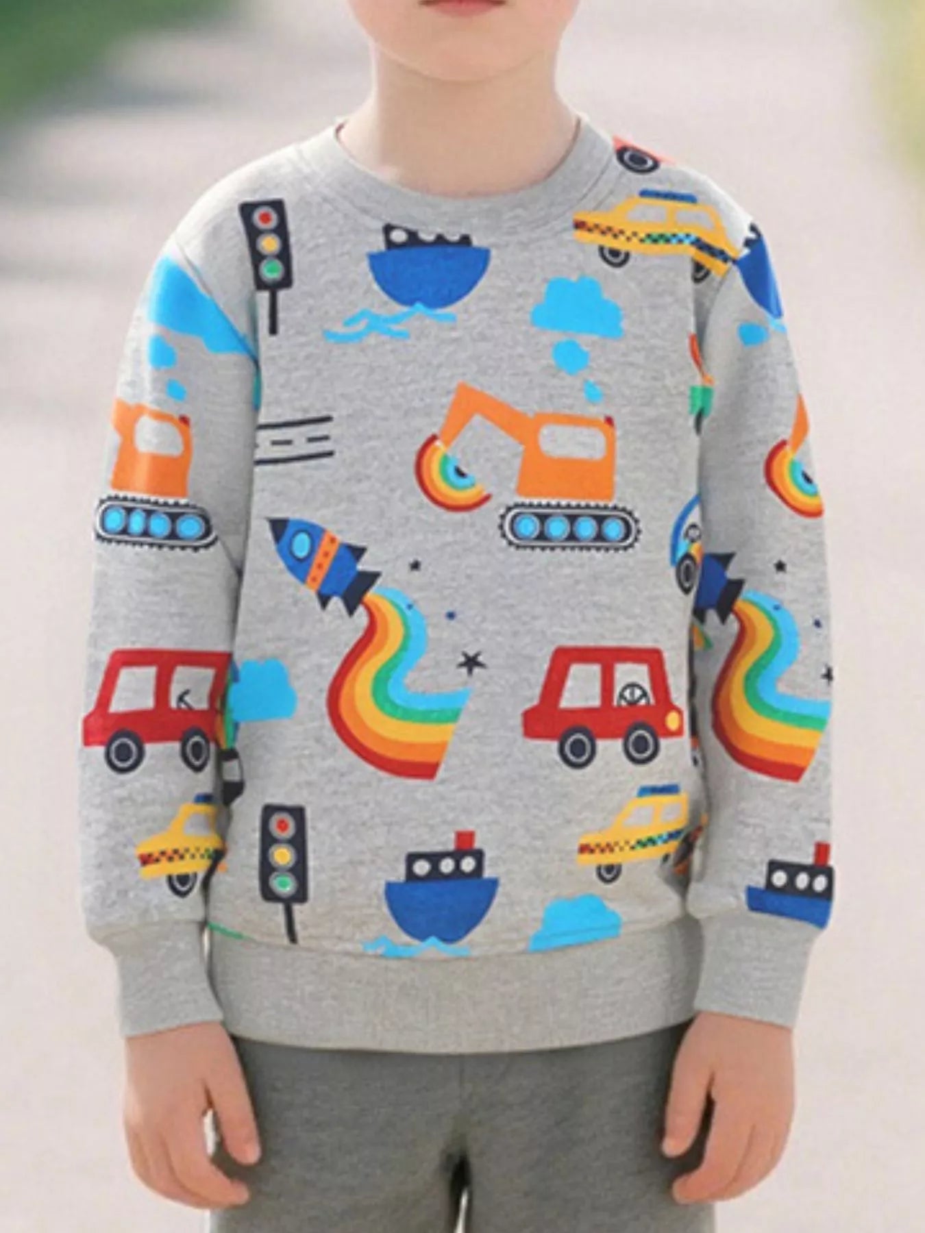 Light gray children's long sleeve sweatshirt with colorful transportation cars boats rockets and excavators front view