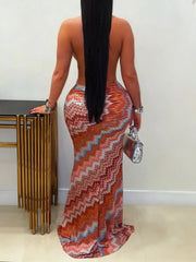 Back view of rust chevron maxi dress showing open back and long skirt
