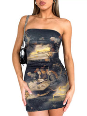 Model wearing a strapless dark brown artistic print bodycon mini dress, front view