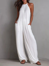 Women's sleeveless wide-leg jumpsuit with pockets and a zipper closure.