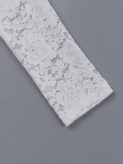 Flat detail of a white lace maxi dress sleeve showing the floral lace pattern
