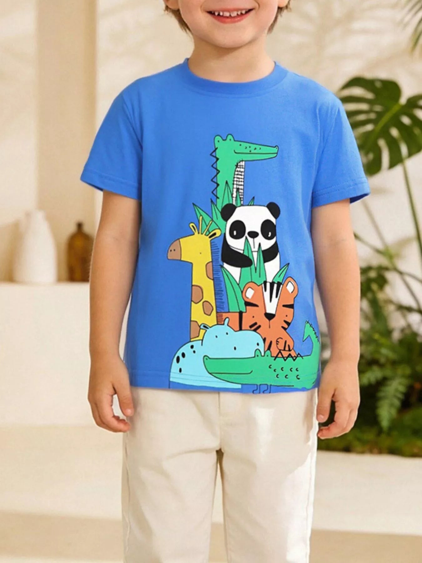 Children's blue crew-neck T-shirt featuring an animal print design.