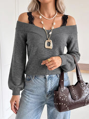 Dark grey off shoulder sweater with black lace trim straps and light jeans