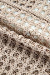 Close view of mocha openwork crochet fabric and edge of the white star detail.