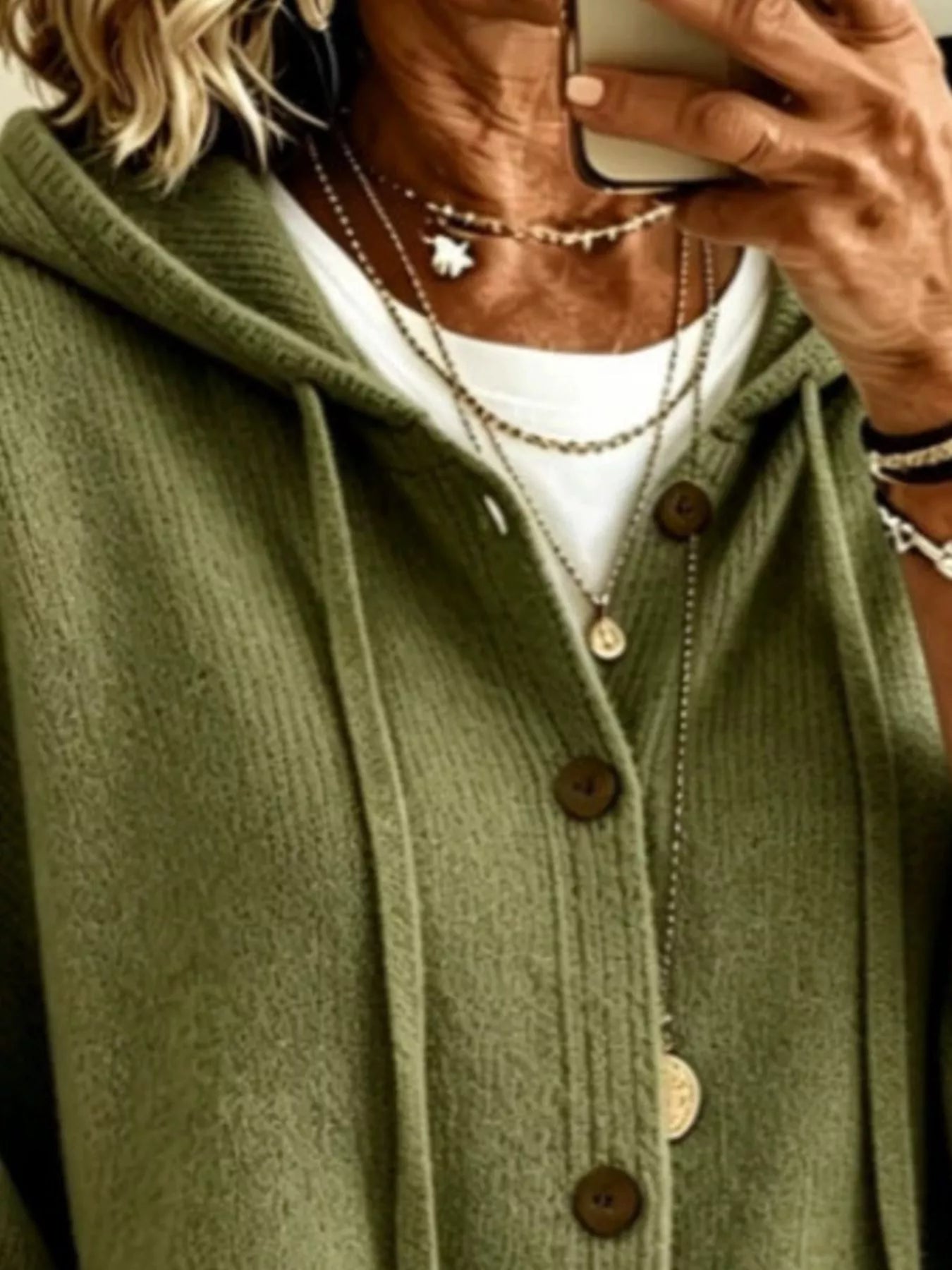 Close view of the army green hooded cardigan showing drawstrings and button front