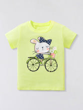 Flat lay front view of children's light green t-shirt with rabbit riding a bicycle graphic