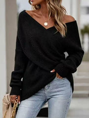 Front view of black ribbed knit sweater with crisscross V neckline and long sleeves.