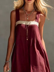 Close front bodice view on model of wine red color block sleeveless linen blend dress