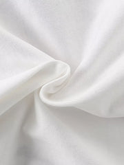 Close-up texture of the soft white fabric of the children's short sleeve shirt