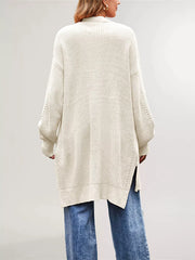 Back view of the cream long open front cardigan with side slits