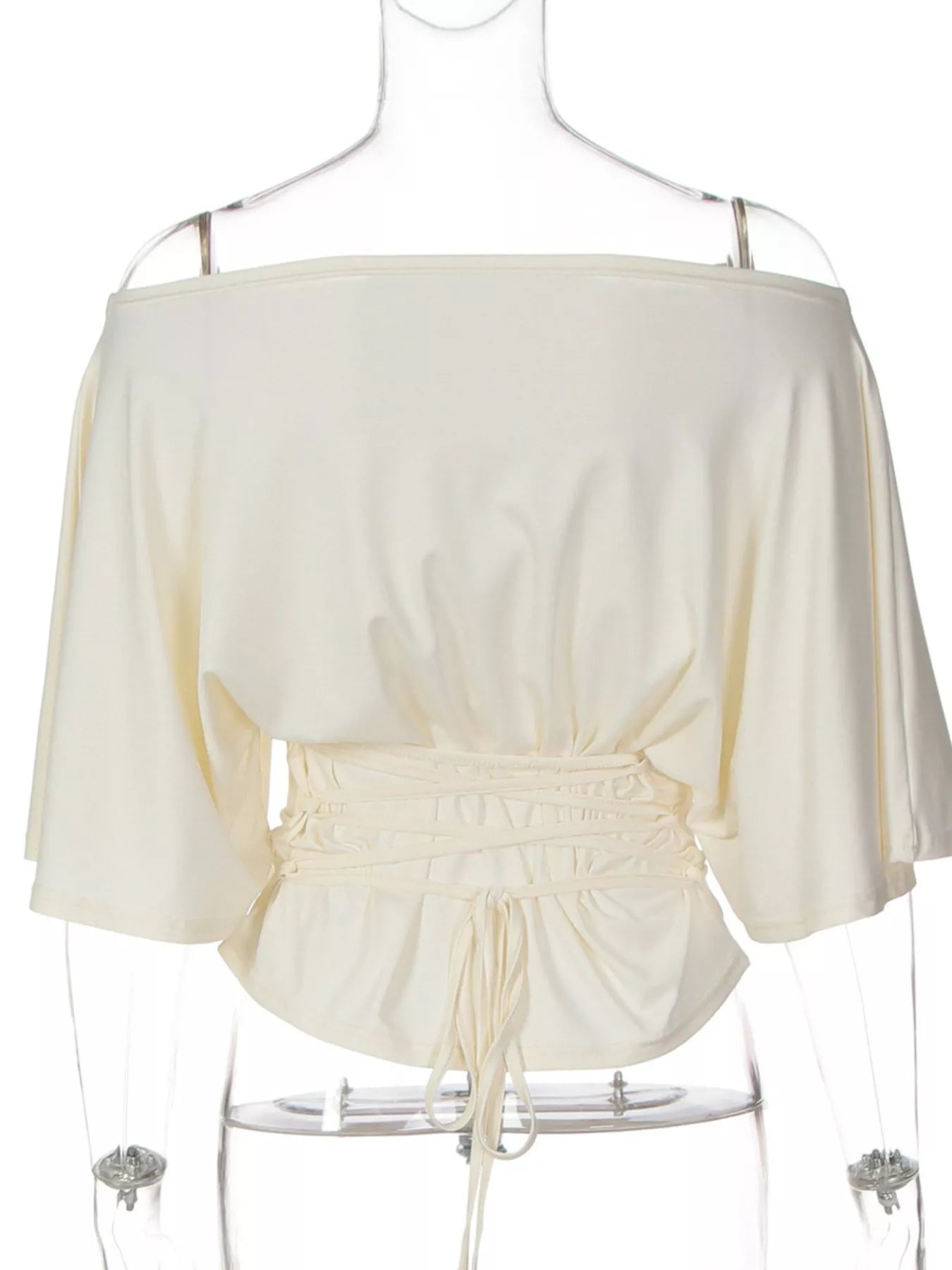 Ivory boat-neck short-sleeve top with ruched waist and adjustable front tie detail.