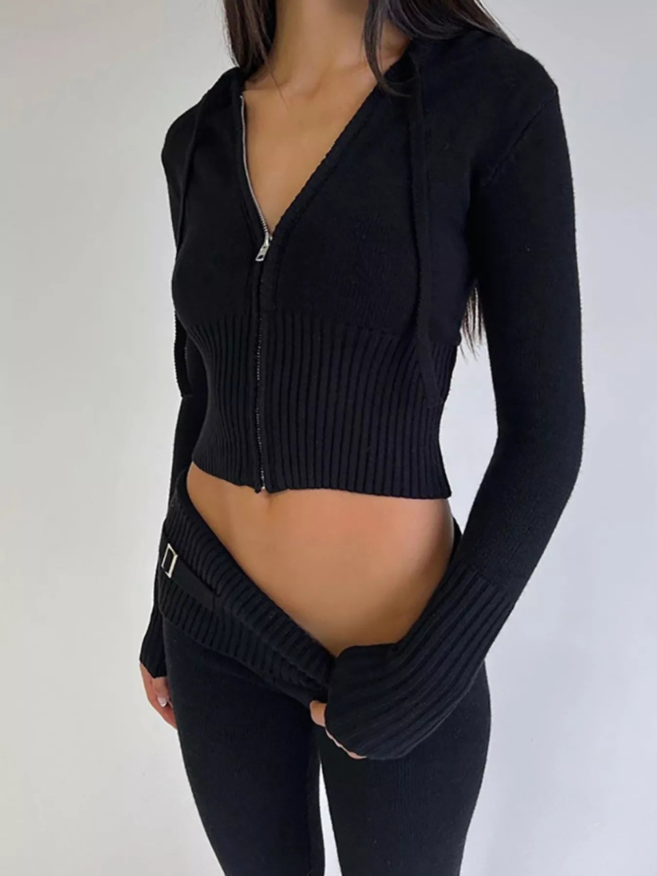 Black ribbed zip up hooded cardigan and matching knit pants worn on model