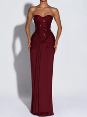 Red strapless sequin corset maxi dress on model, full length front view in studio