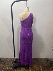 Purple sequin one shoulder evening dress shown from the back on a dress form