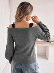 Back view of dark grey off shoulder lace trim sweater with light jeans