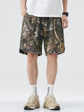Men's loose fit shorts with a drawstring waist and pockets.