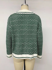 Back view of the green and white geometric collared sweater on a mannequin
