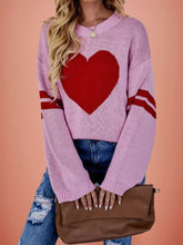 Front view of a pink dropped shoulder sweater with a large red heart
