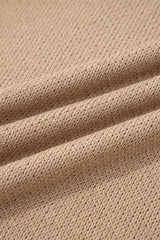 Close-up detail of mocha knit fabric with a fine open texture
